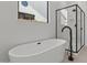 Modern bathroom with sleek soaking tub and glass shower at 42064 N Golden Trl, San Tan Valley, AZ 85140
