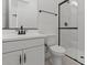 Modern bathroom features a walk-in shower, white vanity, and matte black hardware at 42064 N Golden Trl, San Tan Valley, AZ 85140