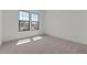 Bright bedroom with cozy carpet and large windows offering ample natural light at 42064 N Golden Trl, San Tan Valley, AZ 85140