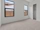 Comfortable bedroom featuring neutral carpet and natural light at 42064 N Golden Trl, San Tan Valley, AZ 85140