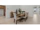 Cozy dining area featuring a rustic wooden table, upholstered chairs, and stylish decor at 42064 N Golden Trl, San Tan Valley, AZ 85140