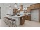 Spacious kitchen with large island, pendant lighting, stainless appliances, and stylish countertops at 42064 N Golden Trl, San Tan Valley, AZ 85140