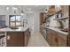 Open kitchen layout with island seating, stainless appliances, and ample cabinet space at 42064 N Golden Trl, San Tan Valley, AZ 85140