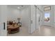 Comfortable living room showcases sliding barn doors, neutral walls, and ample natural light at 42064 N Golden Trl, San Tan Valley, AZ 85140