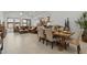 Open-concept living space with dining area, kitchen, and comfortable seating arrangement at 42064 N Golden Trl, San Tan Valley, AZ 85140