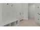 Clean mudroom offers built-in bench seating, storage cubbies, and access to other rooms at 42064 N Golden Trl, San Tan Valley, AZ 85140
