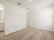A clean bedroom, with neutral carpeting and a view into an adjacent bathroom at 4347 W Hannah St, San Tan Valley, AZ 85144