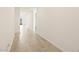 Bright hallway with tile flooring leads to an open-concept living space at 4347 W Hannah St, San Tan Valley, AZ 85144