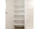 Built-in open shelving provides ample storage space beside the shower at 4347 W Hannah St, San Tan Valley, AZ 85144