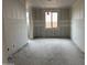Bedroom ready for personalization with a window providing natural light at 7736 W Coyote Dr, Peoria, AZ 85383