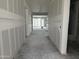 A long hallway with finished walls, leading to the rest of the property at 7736 W Coyote Dr, Peoria, AZ 85383