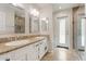 Bright bathroom with double sinks, granite countertops, and a glass-enclosed shower, blending style and functionality at 9802 N 77Th St, Scottsdale, AZ 85258