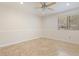 Cozy bedroom with tile flooring, natural light, and neutral walls, perfect for relaxation and personalization at 9802 N 77Th St, Scottsdale, AZ 85258