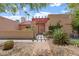 Front exterior of a home with desert landscaping and a covered entrance at 9802 N 77Th St, Scottsdale, AZ 85258
