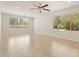 Spacious living area features tile flooring and large windows that allow natural light to flood the space at 9802 N 77Th St, Scottsdale, AZ 85258