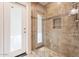 Modern shower with glass enclosure and tiled walls, designed for a luxurious and spa-like experience at 9802 N 77Th St, Scottsdale, AZ 85258