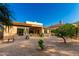 Outdoor patio boasts an inviting space for relaxation and entertainment with desert landscaping at 15140 E Staghorn Dr, Fountain Hills, AZ 85268