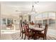 Dining room with a large dark wood table, statement lighting and a view of the kitchen at 15140 E Staghorn Dr, Fountain Hills, AZ 85268