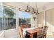 This lovely dining room features large picture windows, a decorative chandelier, and stylish decor at 15140 E Staghorn Dr, Fountain Hills, AZ 85268