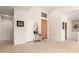 Welcoming foyer featuring neutral tile flooring and a front door with decorative trim at 15140 E Staghorn Dr, Fountain Hills, AZ 85268