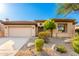Charming single-story home featuring desert landscaping and a welcoming two-car garage at 15140 E Staghorn Dr, Fountain Hills, AZ 85268