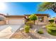 Charming home featuring manicured desert landscaping, a two-car garage, and a welcoming entrance at 15140 E Staghorn Dr, Fountain Hills, AZ 85268