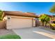 Well-maintained home featuring a two-car garage, desert landscaping, and a cozy facade at 15140 E Staghorn Dr, Fountain Hills, AZ 85268