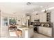 Bright open kitchen featuring stainless steel appliances and a granite island with a breakfast bar at 15140 E Staghorn Dr, Fountain Hills, AZ 85268