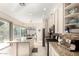 Bright kitchen featuring stone countertops, stainless appliances, and a large sliding glass door to the backyard at 15140 E Staghorn Dr, Fountain Hills, AZ 85268