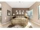 This main bedroom features a brass bed frame, neutral walls, and a decorative ceiling fan at 15140 E Staghorn Dr, Fountain Hills, AZ 85268