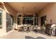 Covered patio featuring a dining table and barbecue, offering the perfect spot for outdoor dining and entertaining at 15140 E Staghorn Dr, Fountain Hills, AZ 85268