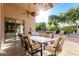 Covered patio features a dining table and built-in barbecue, ideal for outdoor entertaining and relaxation at 15140 E Staghorn Dr, Fountain Hills, AZ 85268