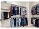 Spacious walk-in closet provides ample hanging storage space with shelving and rods on multiple levels at 15140 E Staghorn Dr, Fountain Hills, AZ 85268