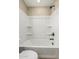 Bathroom with a combined bathtub and shower and tile surround at 15587 S 180Th Ln, Goodyear, AZ 85338