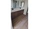 Modern bathroom with dual sinks, a large mirror, and a glass-enclosed shower at 15587 S 180Th Ln, Goodyear, AZ 85338