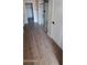 Bathroom with a glass-enclosed shower and wood-look tile flooring at 15587 S 180Th Ln, Goodyear, AZ 85338
