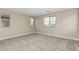 Bedroom featuring neutral walls, carpet, two windows, and ample natural light at 15587 S 180Th Ln, Goodyear, AZ 85338