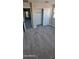 Bedroom with neutral carpet, closet with sliding doors, and natural light from a window at 15587 S 180Th Ln, Goodyear, AZ 85338