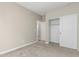 Bedroom with neutral walls, carpet flooring, walk-in closet, and access to additional rooms at 15587 S 180Th Ln, Goodyear, AZ 85338