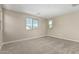 Bright bedroom featuring neutral walls, carpet floors and nice views from windows at 15587 S 180Th Ln, Goodyear, AZ 85338
