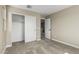 Bedroom with closet with sliding doors and neutral walls and carpet at 15587 S 180Th Ln, Goodyear, AZ 85338
