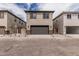 Two story home with a neutral color scheme, two car garage and minimal landscaping in the front yard at 15587 S 180Th Ln, Goodyear, AZ 85338
