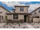 Inviting two-story home with stylish stone accents and low maintenance gravel front yard at 15587 S 180Th Ln, Goodyear, AZ 85338
