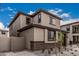 Attractive home with stone accents, gravel front yard, complemented by nearby residences and landscaping at 15587 S 180Th Ln, Goodyear, AZ 85338