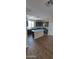 Bright kitchen features a center island, granite countertops, and modern cabinetry at 15587 S 180Th Ln, Goodyear, AZ 85338
