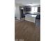 Open kitchen boasts a large island, granite countertops, and stainless steel appliances at 15587 S 180Th Ln, Goodyear, AZ 85338