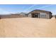 A spacious dirt backyard, ready for a buyer to add landscaping and personalization at 17561 W Pierson St, Goodyear, AZ 85395