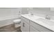 Bright bathroom featuring double sinks, a bathtub and a toilet at 17561 W Pierson St, Goodyear, AZ 85395