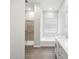 Bright bathroom with separate shower and tub, along with double sinks and tile flooring at 17561 W Pierson St, Goodyear, AZ 85395