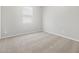 Neutral bedroom with carpet, a window, and outlets at 17561 W Pierson St, Goodyear, AZ 85395